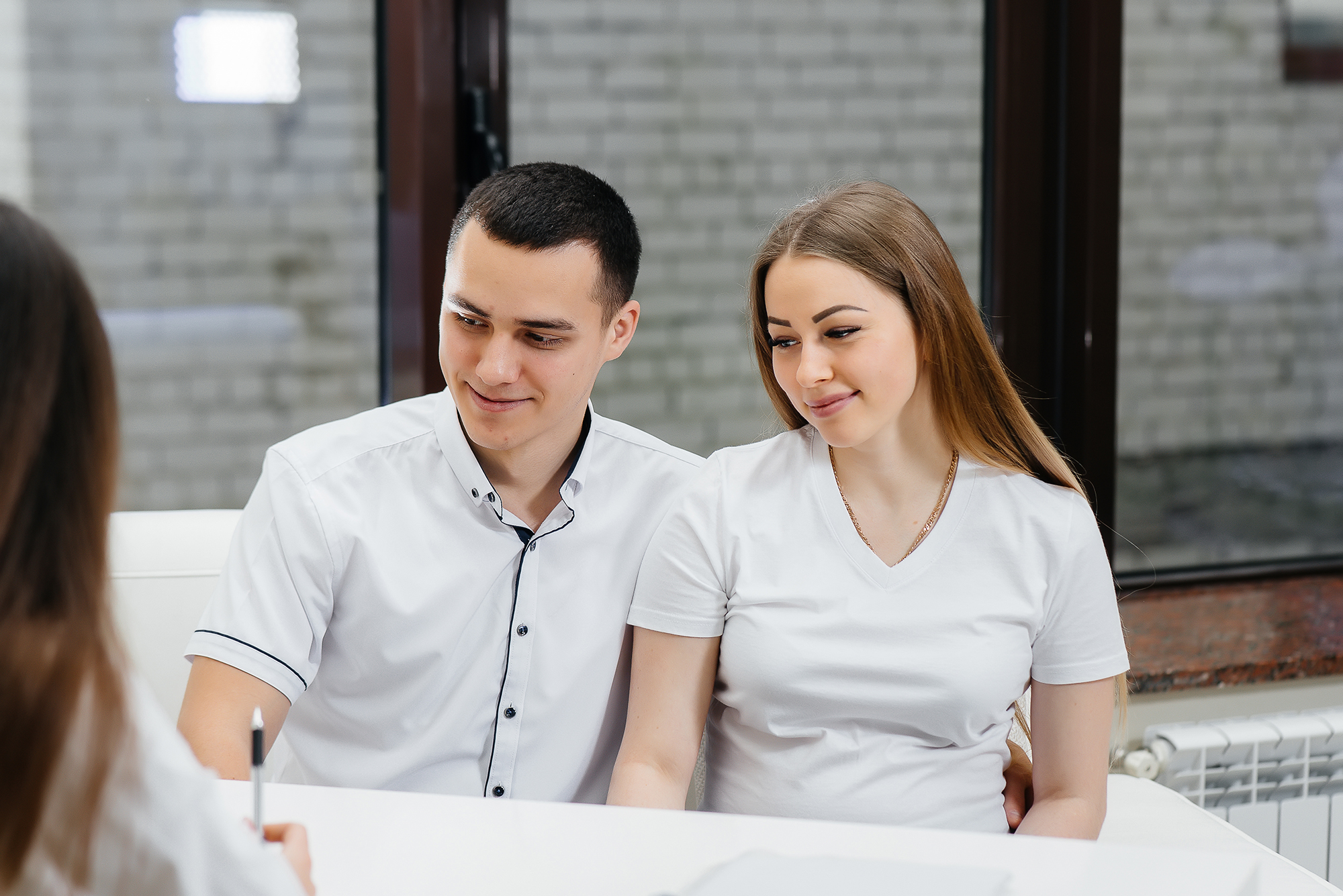 Young couple at doctors desk discussing family planning Complete Healthcare Primary Care and Gynecology