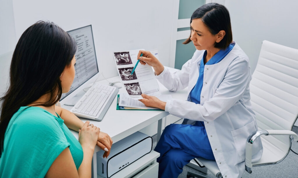 gynecologist discussing scans with female patient