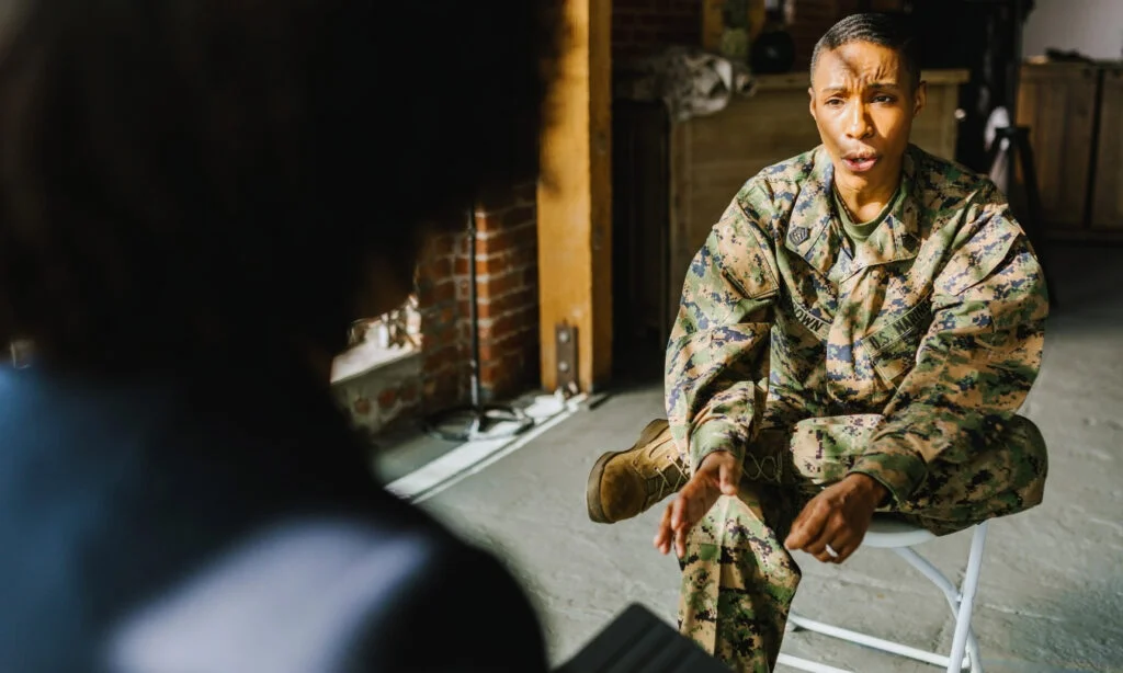 female soldier talking a therapist